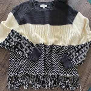 Color block sweater with fringe detail